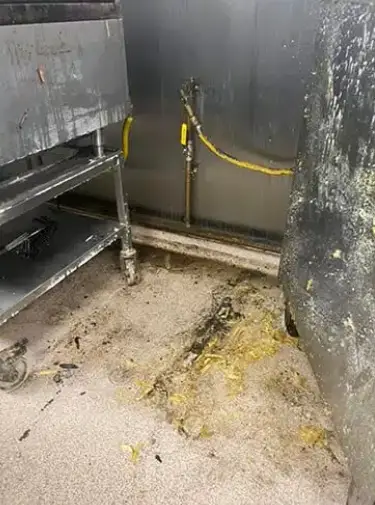 Greasy commercial kitchen before deep clean